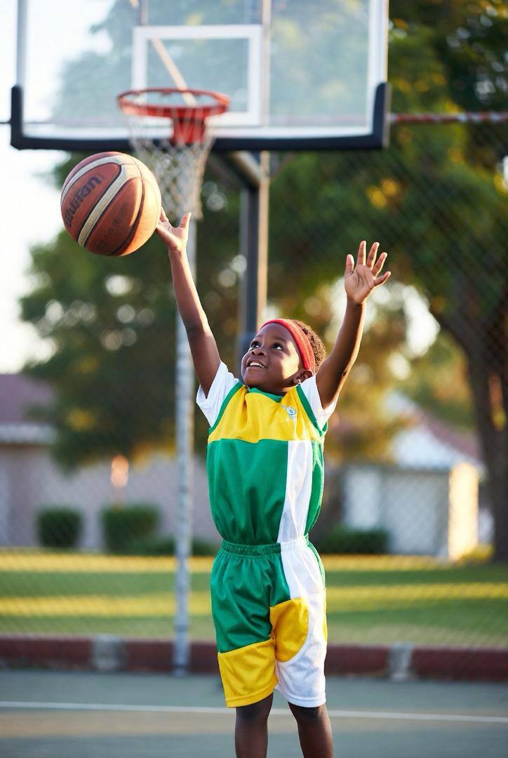 Young player shooting a layup