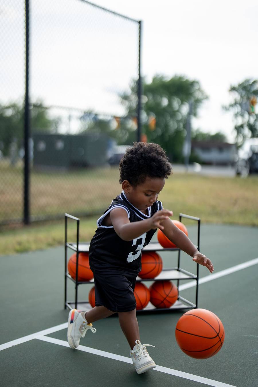 Toddler dribbling a basketball